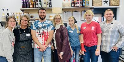 Rep. Hinson with the Cabin Coffee team in Cresco